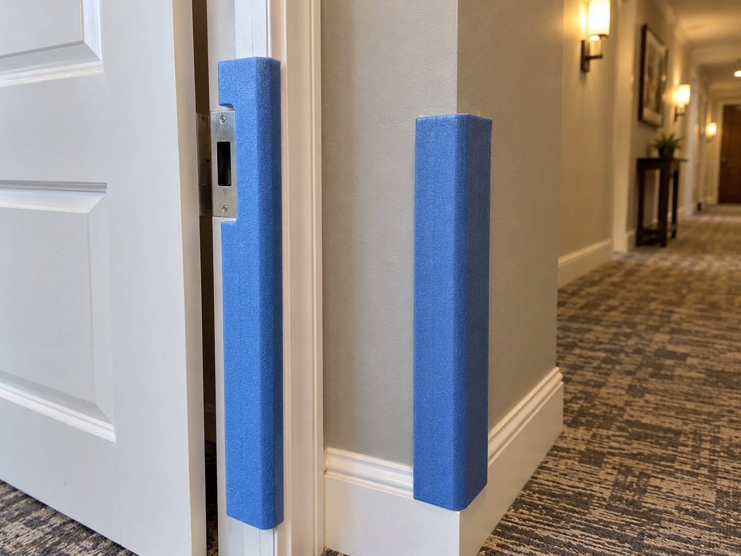 Blue foam guards protecting a door jamb and wall corner